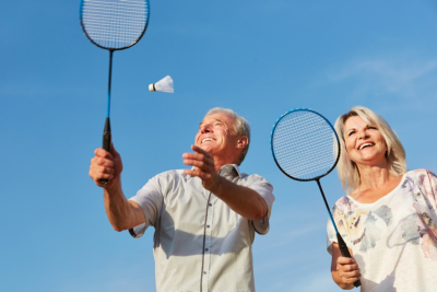 senior couple playing badminton